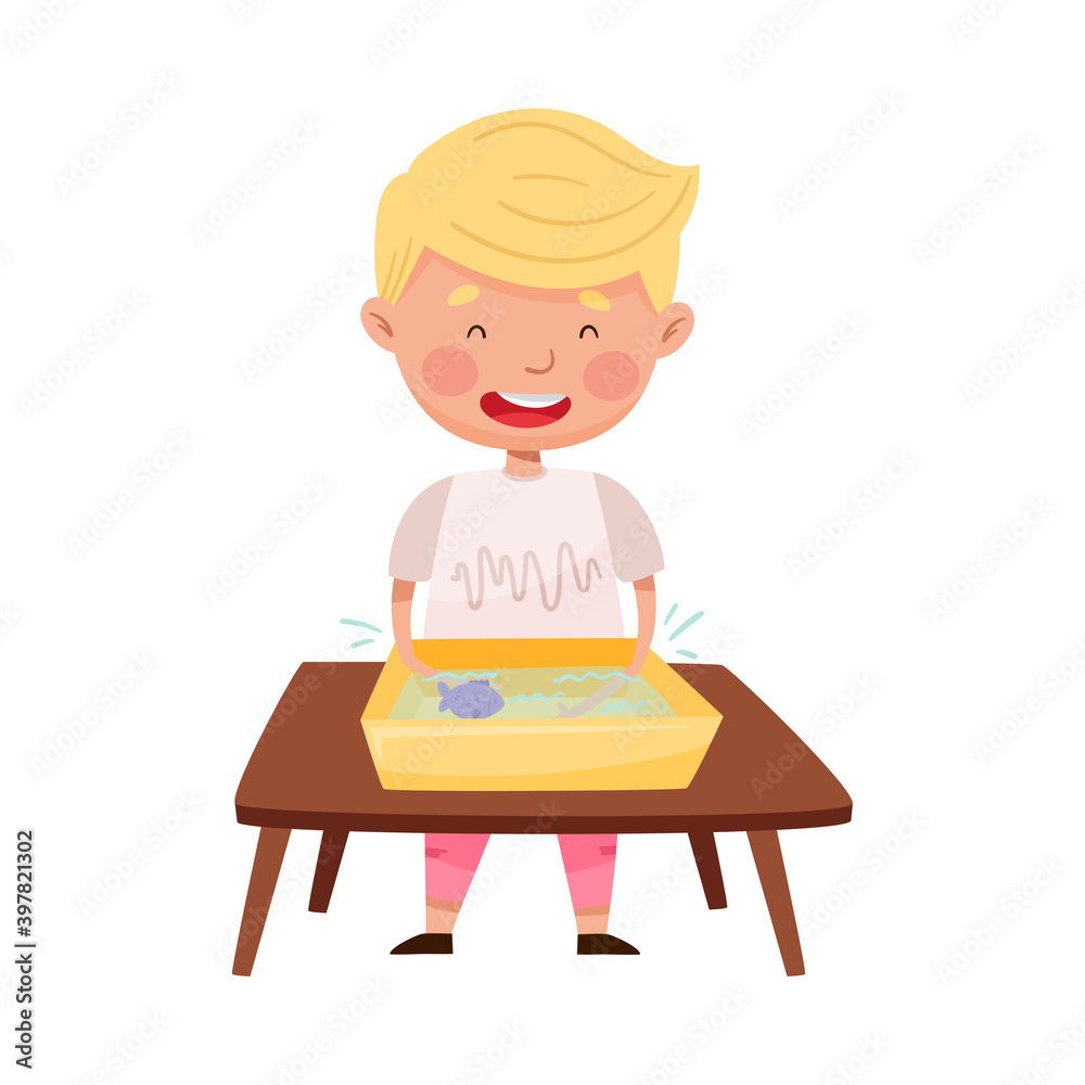 Little Boy Standing at Table and Splashing in Water Basin with Fish Vector Illustration