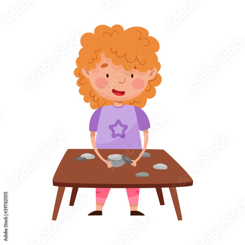 Red Haired Girl at Desk Playing with Pebbles Vector Illustration