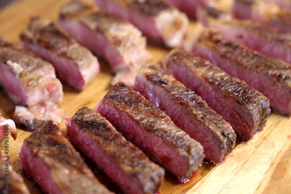 Short Rib. Delicious cut of meat located on the rib of the cow. In wooden background Short Rib. Delicious cut of meat located on the rib of the cow. In wooden background