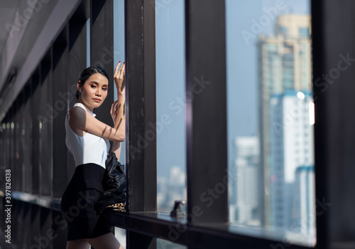 Free Download Businesswoman working in the office with looking out of the window - GFXLoad
