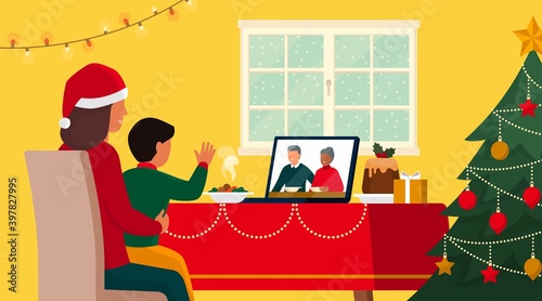 Families celebrating Christmas at home and connecting online on video call