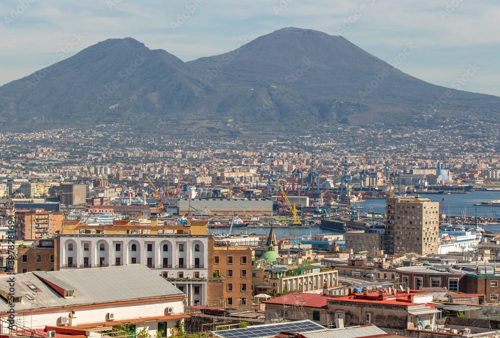 Naples, Italy - probably the most notable landmark in Napoli and potentially an active volcano, Mount Vesuvius stands out on the background of the city