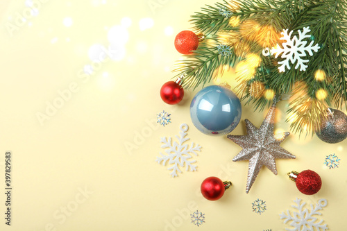 Beautiful Christmas or New Year background with place for text on colored background top view with golden bokeh.