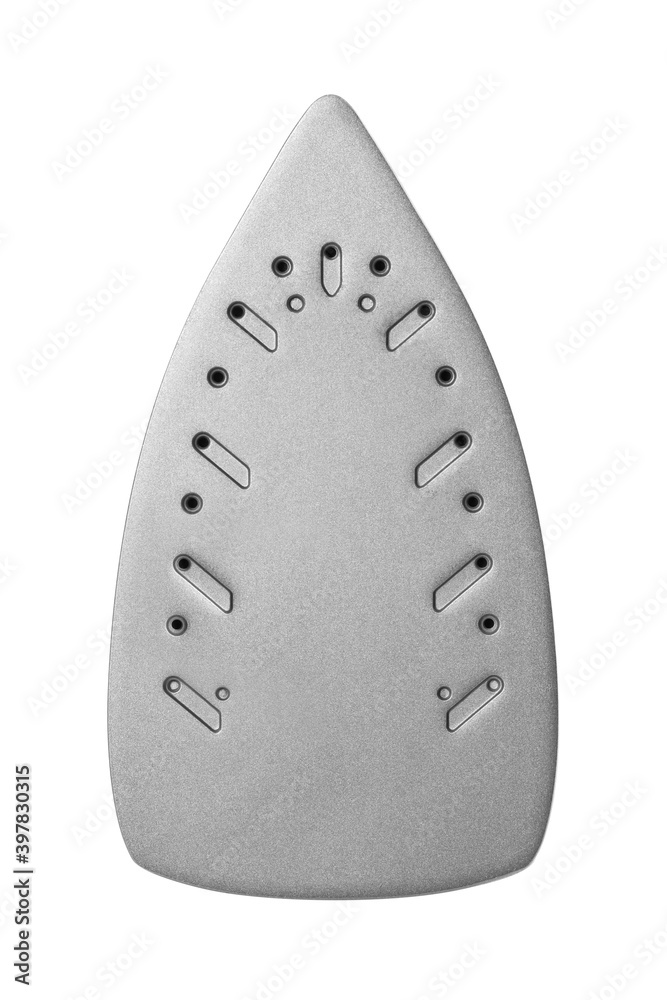 The sole of an electric iron. Close up. Isolated on a white background The sole of an electric iron. Close up. Isolated on a white background