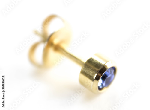 Gold stud earrings. Close up. Isolated on a white background