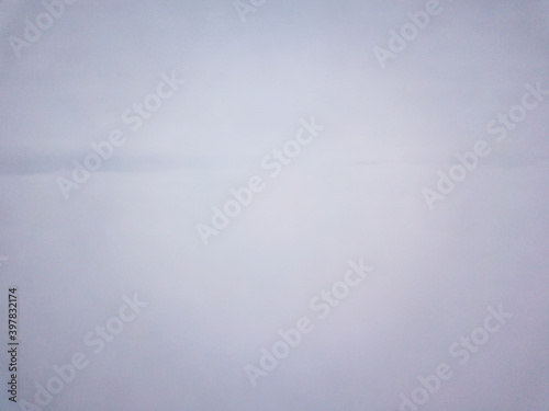 Aerial drone view. High flight over the fog in the clouds.