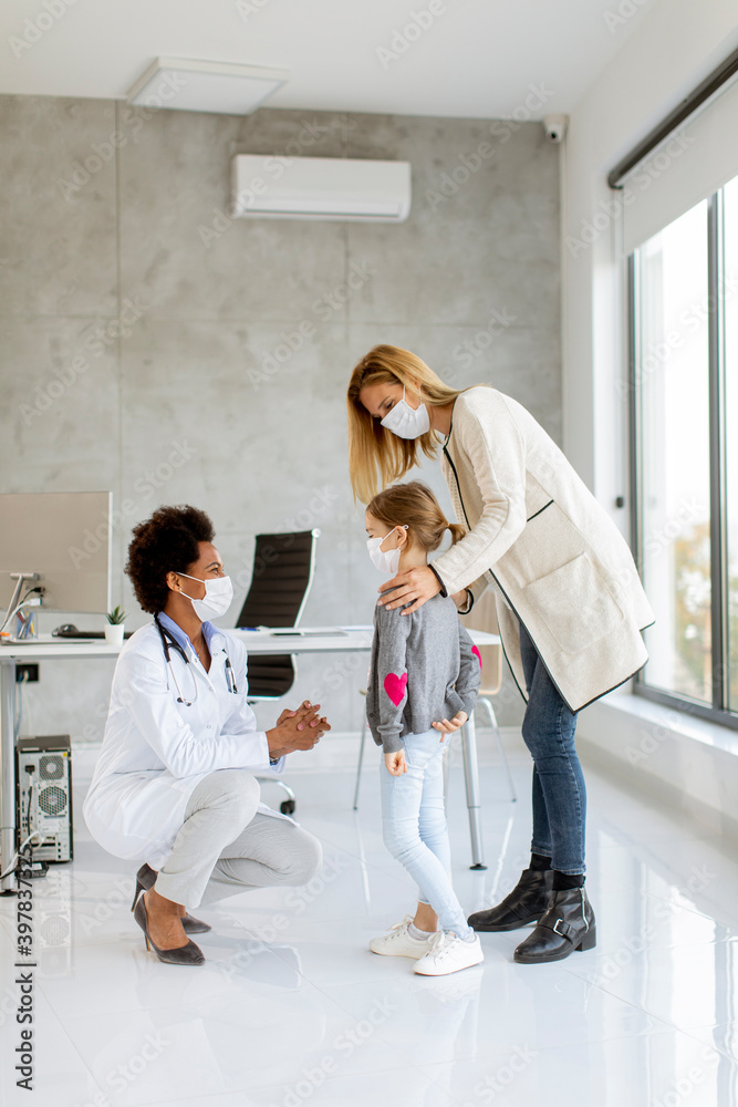 Fototapeta premium Mother with his little daughter at the pediatrician examination