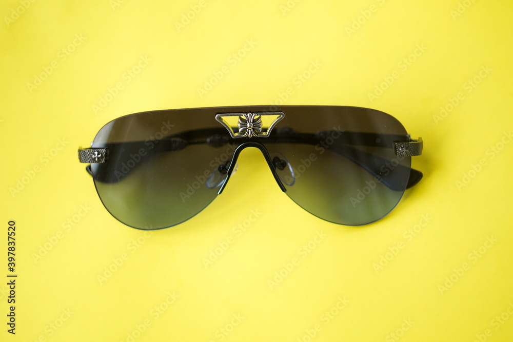 sunglasses on yellow background 