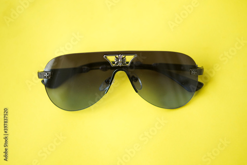 sunglasses on yellow background 