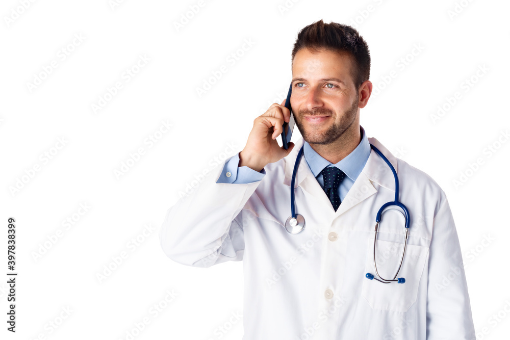 Male doctor using his phone while standing at isolated white background Male doctor using his phone while standing at isolated white background
