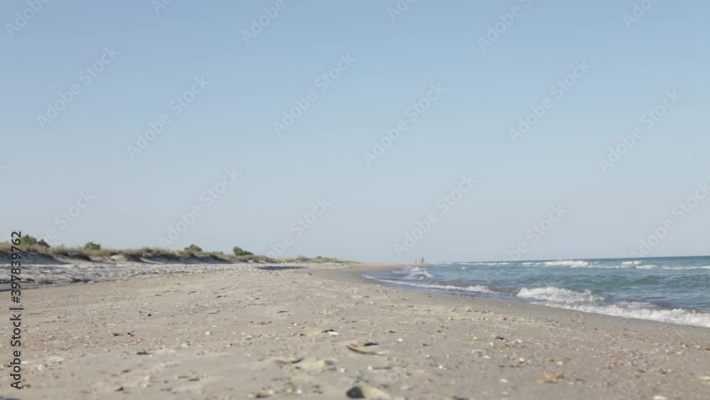Closeup of dolly shot follow on of an empty sea beach Closeup of dolly shot follow on of an empty sea beach