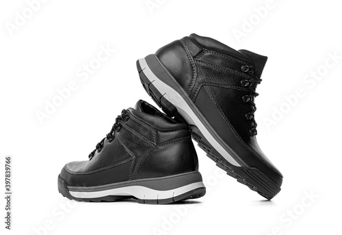 Black winter boots isolated on white background.
