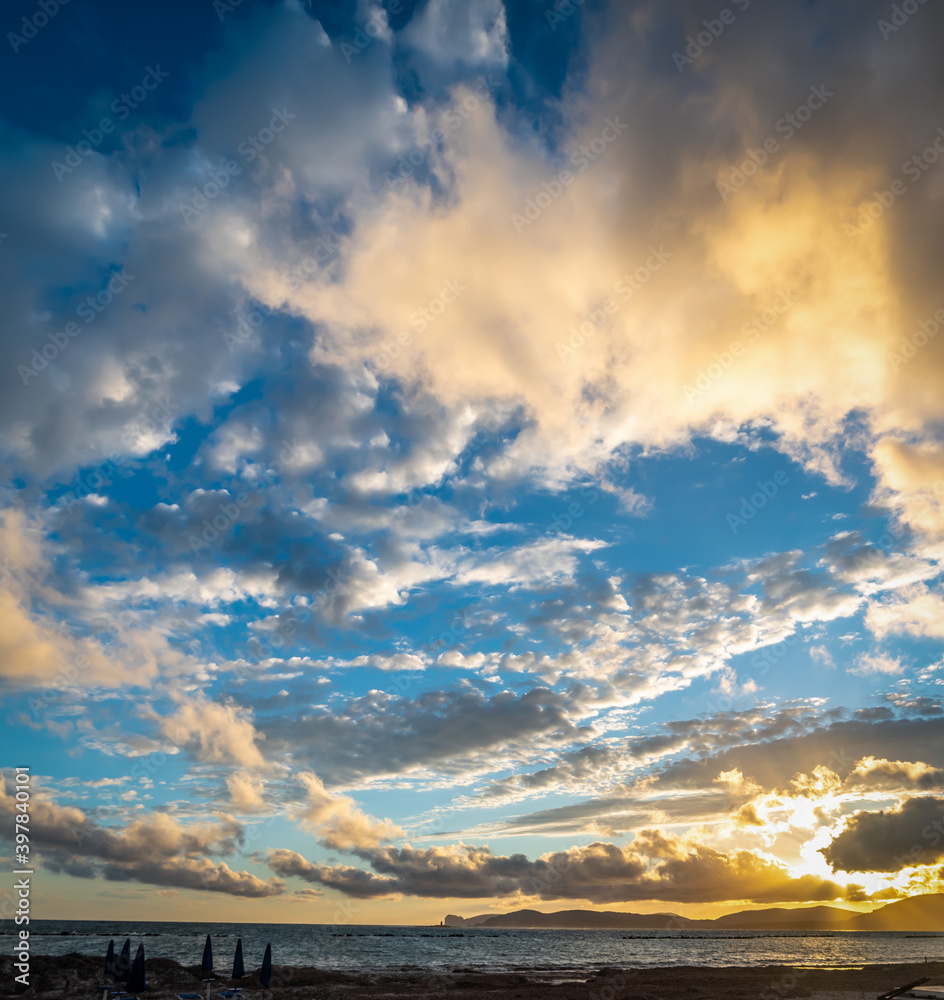 Naklejka premium Dramatic sky over Capo Caccia at sunset