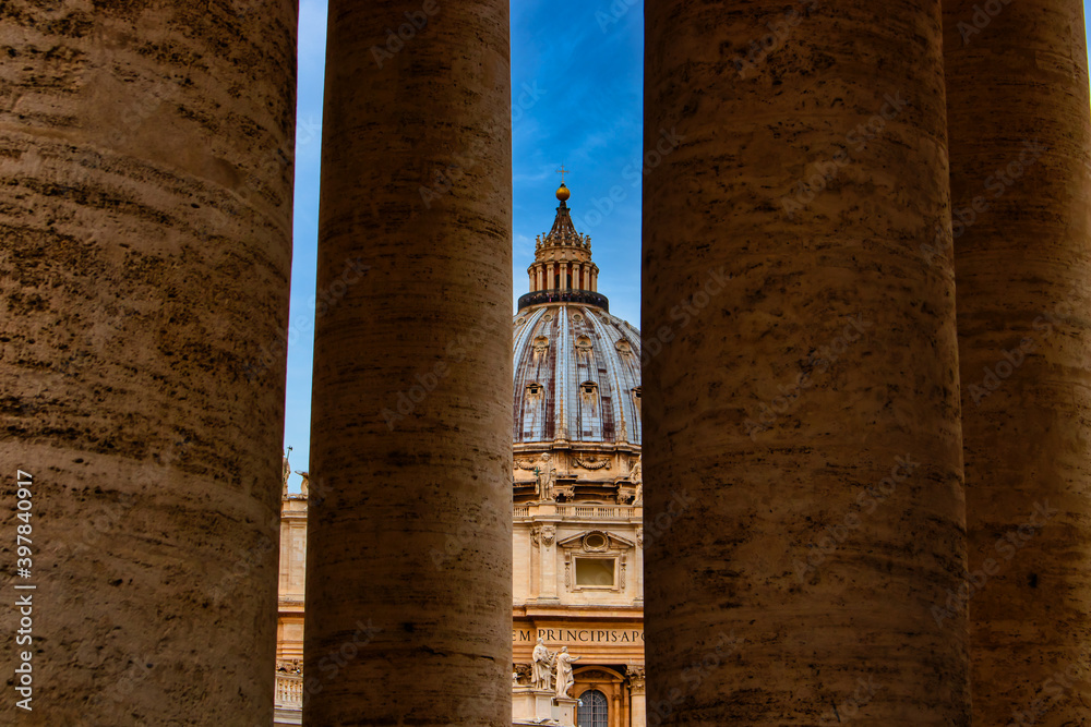 View through a few columns on St. Peter's Basilica.