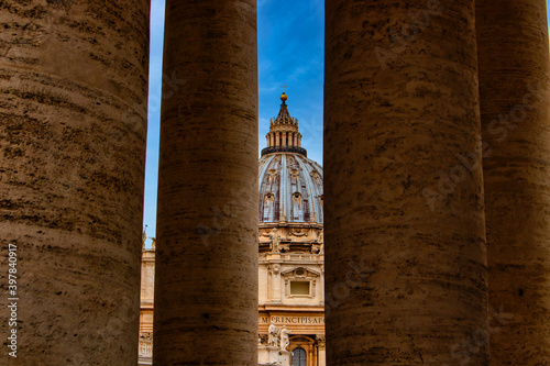 View through a few columns on St. Peter's Basilica.