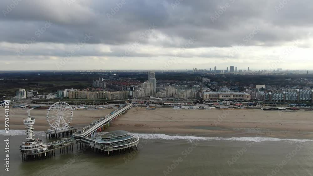 4k aerial video of the pier, with ferris wheel and attractions in dutch beach town Scheveningen 4k aerial video of the pier, with ferris wheel and attractions in dutch beach town Scheveningen