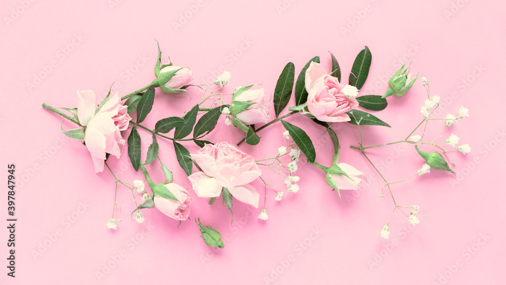 Creative layout made with pink and violet flowers on pink background. Flat lay.