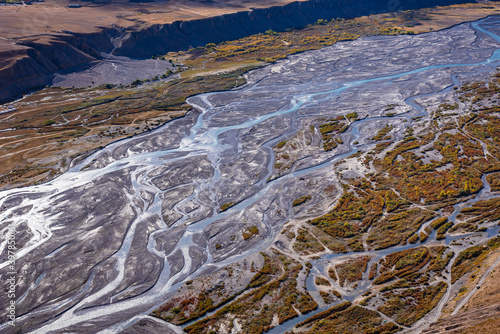 Braided rivers consist of islands occurs in rapid   frequent changes in river water high sediment load   weak banks when a threshold level of sediment load or slope is reaches mainting steep gradient.