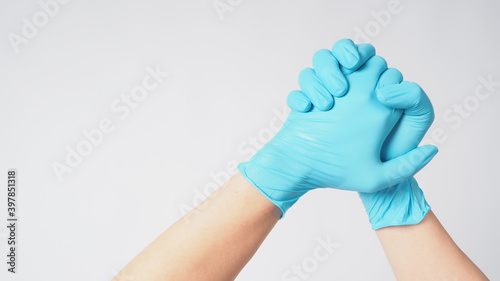 Two hand with blue latex gloves on white background.