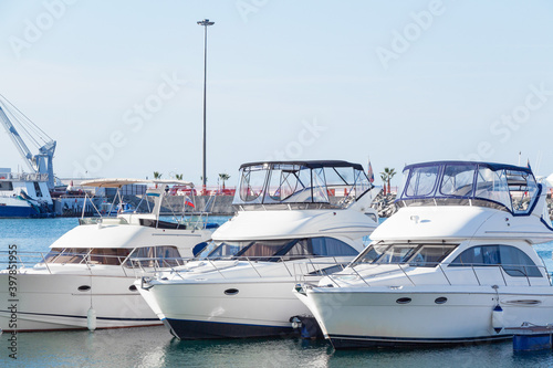 White yachts in the port. Boats in the blue water harbor. © MARGARITA 18