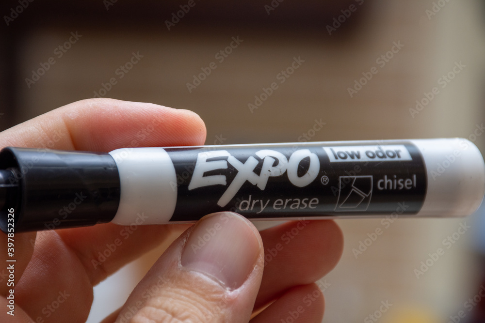 Expo Dry Erase marker, black, with hand holding for whiteboards. Mistakes,  remove, education concepts Stock Photo | Adobe Stock