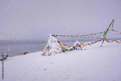 Snowy Chandratal or Lake of the moon is a high altitude lake located at 4300m in Himalayas of Spiti Valley, Himachal Pradesh, India. The name of Lake originated due to its crescent moon like shape. photo