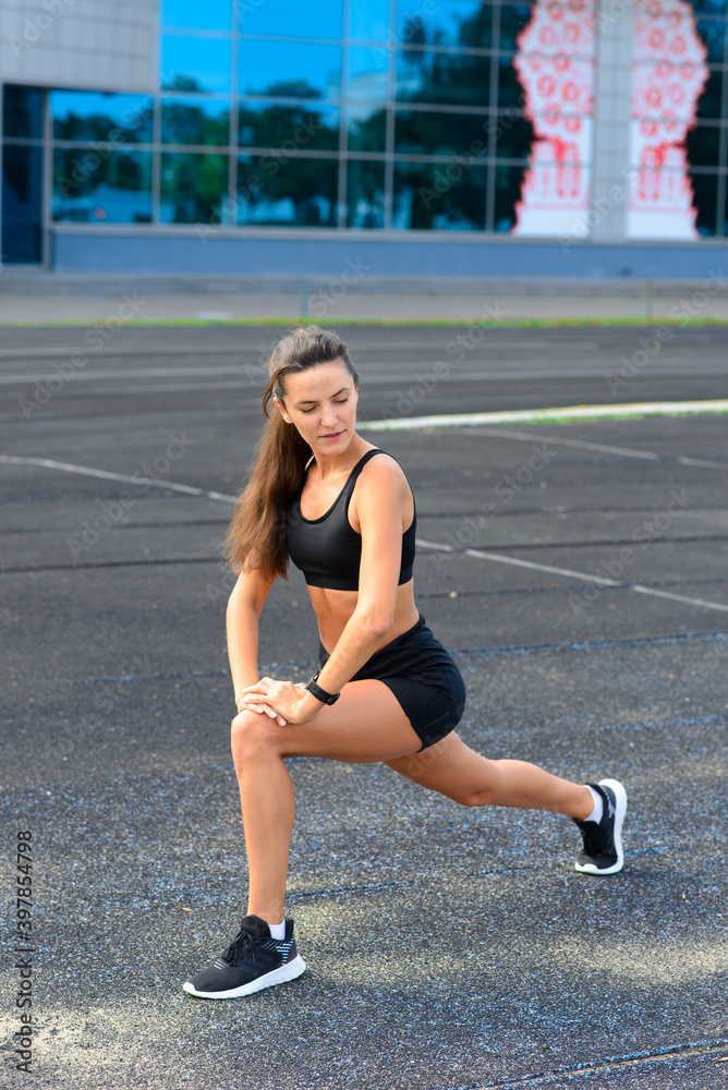Athlete runner running on athletic track training her cardio. Athlete runner running on athletic track training her cardio.