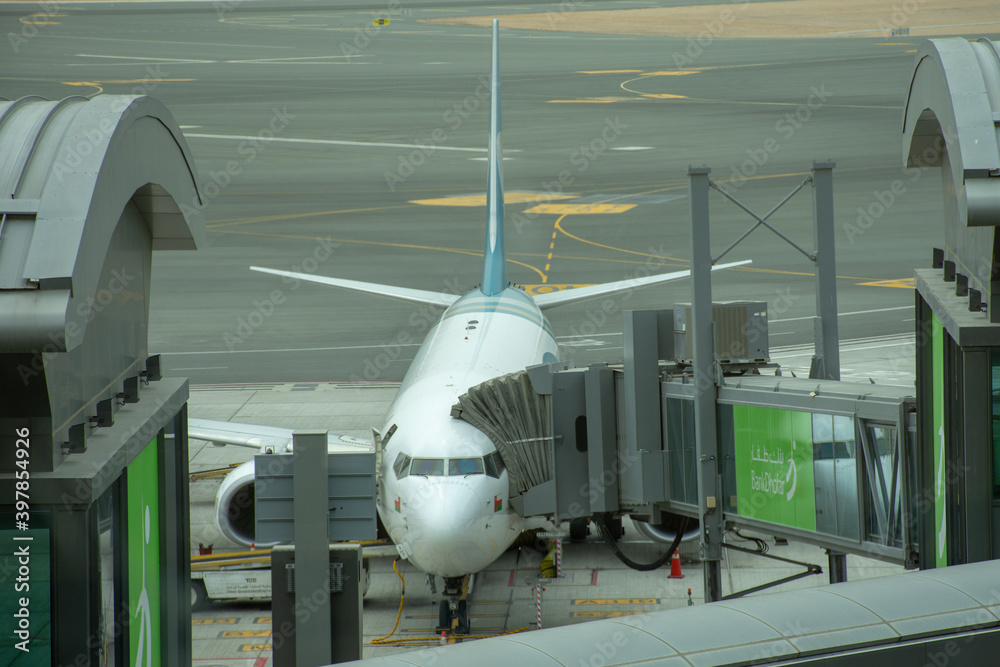 Oman Air Airplane at the terminal at Muscat International Airport. Air