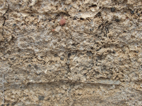 Background from rock texture close-up. The wall of natural stone