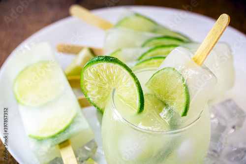 lemon and cachaça popsicle, drink from Brazil called caipirinha served with alcoholic drink ice cream. photo