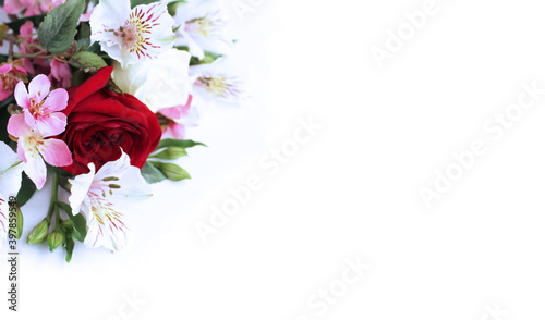 Red rose and white astromeria in a festive bouquet on a white background. Background for greeting cards, invitations. photo