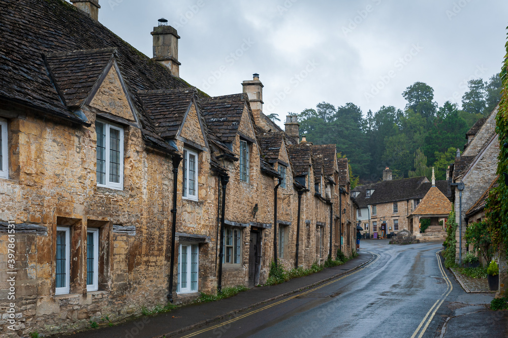 Step back in time and visit Castle Combs, quaint village with well preserved masonry houses dated back to 13 century. Castle Combe, a picturesque medieval village in England. UK.