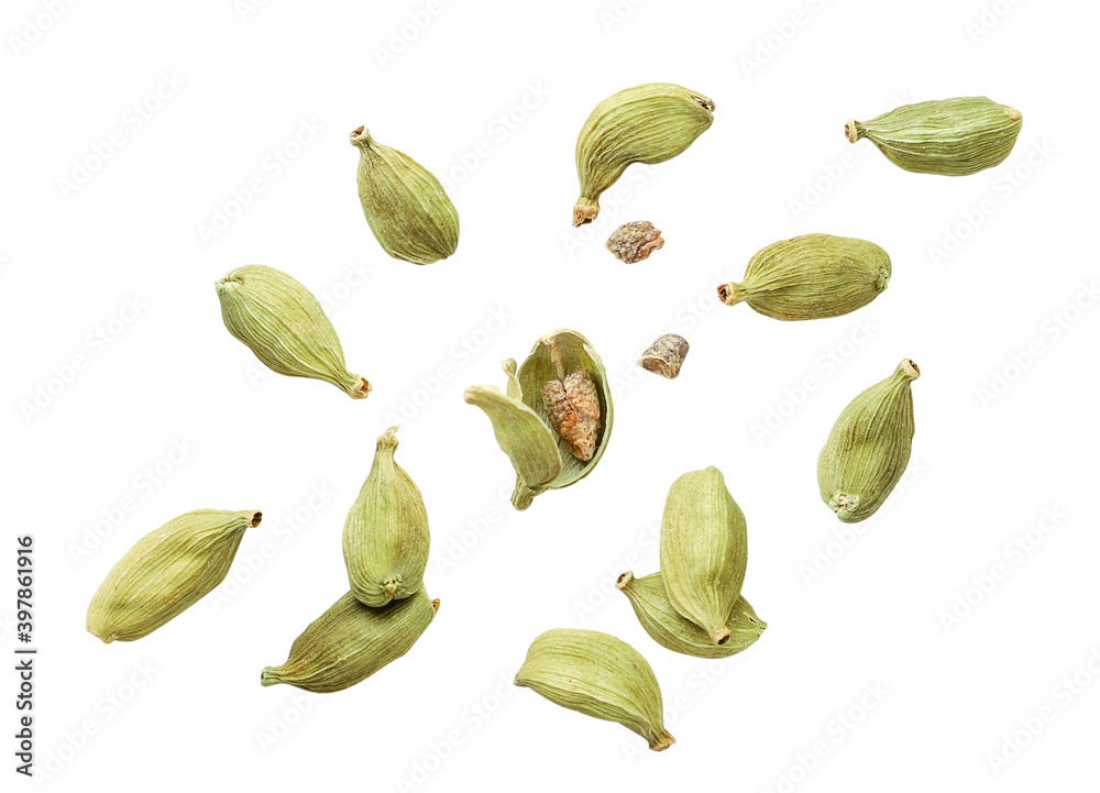 Cardamom pods whole and chopped fly on a white background. Isolated - obrazy, fototapety, plakaty 