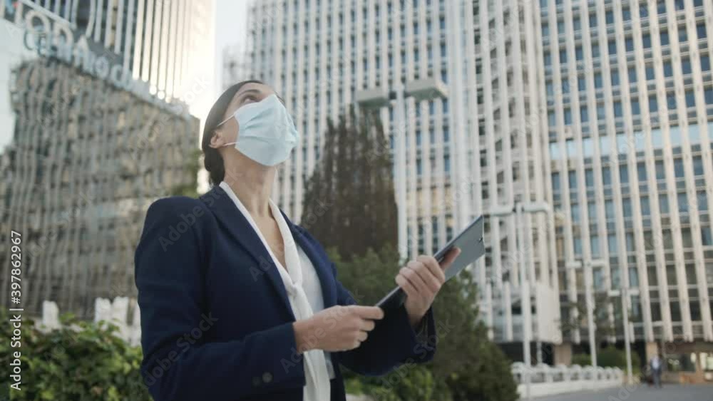 Woman working in Office with Facemask