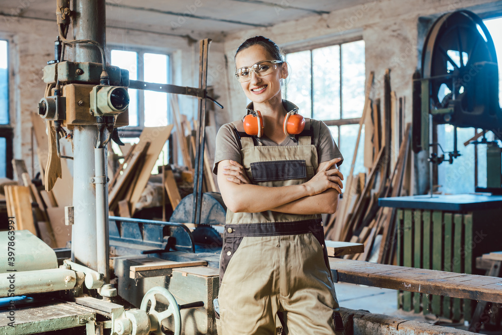 Beautiful woman carpenter in her woodwork workshop Beautiful woman carpenter in her woodwork workshop