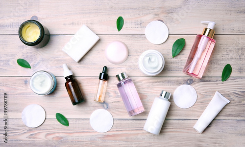 Body care cosmetics top view on wooden background.Cosmetic bottles flat lay on table.Wash items,spa products.Skin hygiene set.