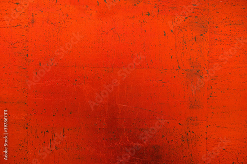 Bright red surface. Different red shades. Rough texture. Copy space. 