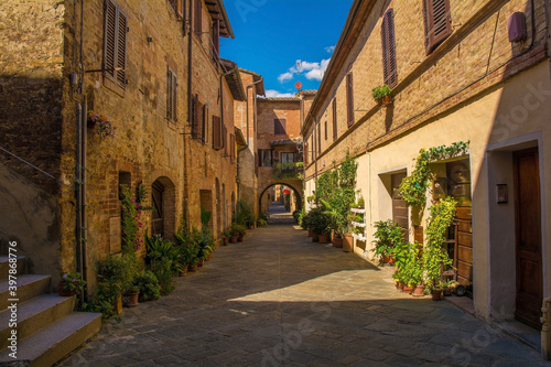 Fototapeta Naklejka Na Ścianę i Meble -  A quiet residential back street in the historic medieval village of Buonconvento, Siena Province, Tuscany, Italy
