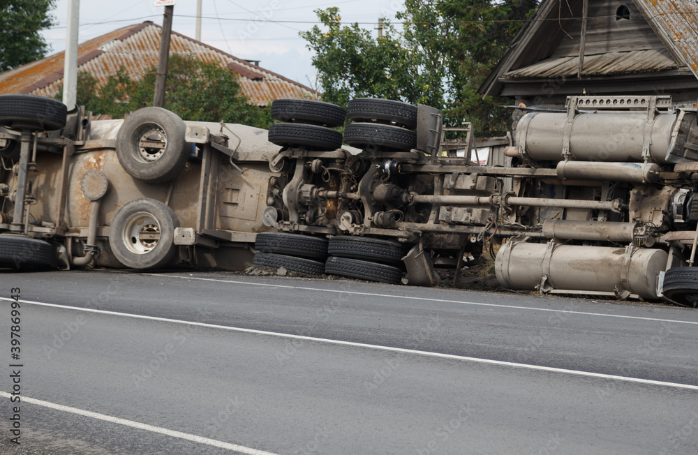 A view of an overturned truck on an highway in an accident.