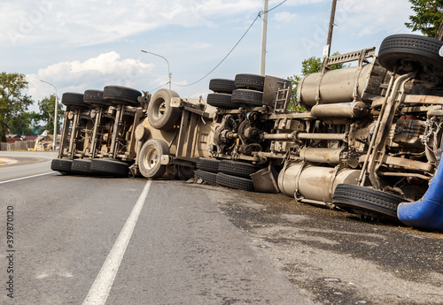 A view of an overturned truck on an highway in an accident.