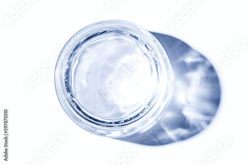 Jar of hydrating hyaluronic gel for face isolated on white background.