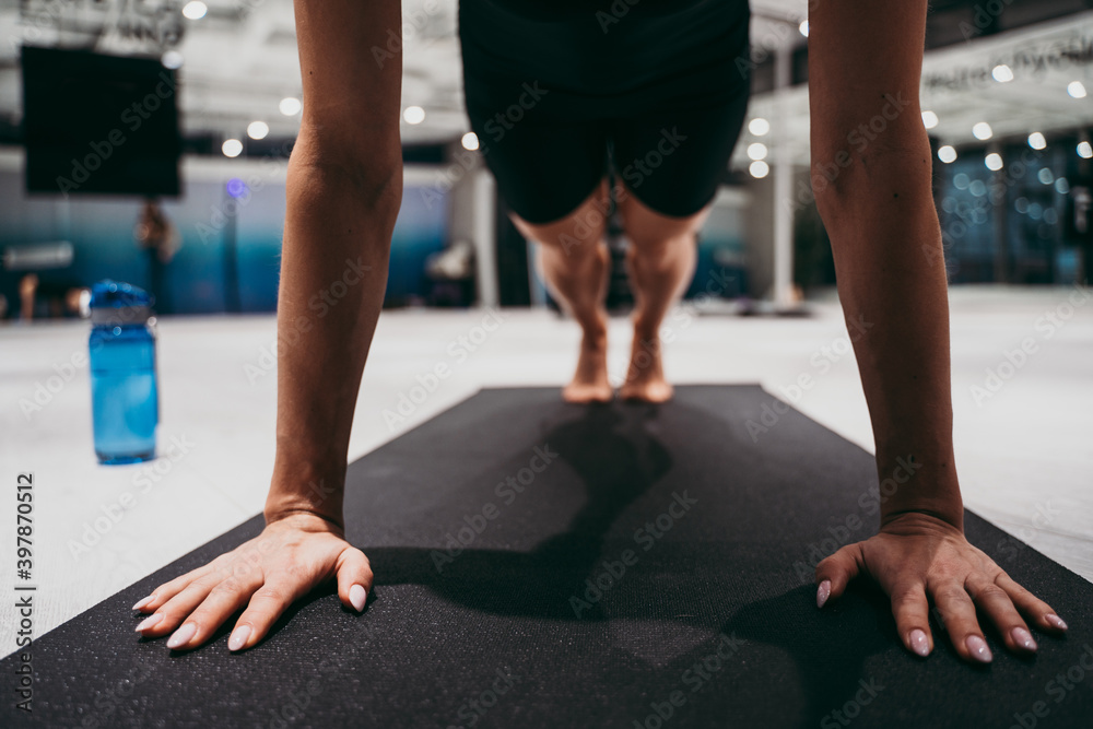Fototapeta premium Beautiful girl training in the gym.