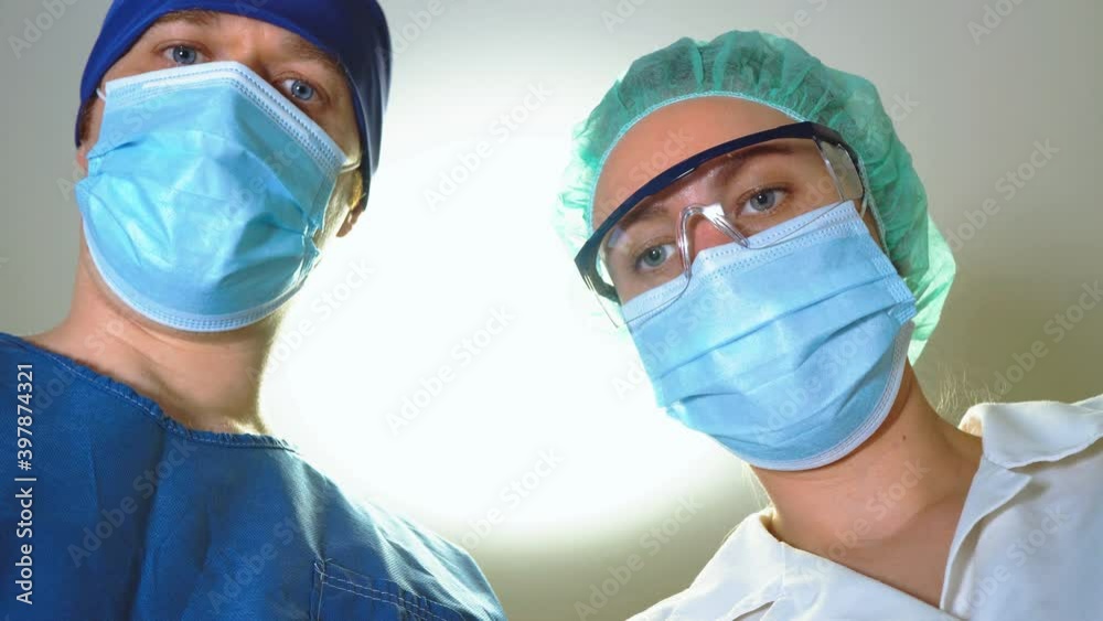 Anesthesiologists taking away gas mask. Waking Up to Anesthesia. Anesthesiologists taking away gas mask. Waking Up to Anesthesia.