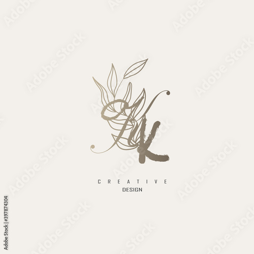 logo kk dengan warna emas, logo terinspirasi dari daun dan kuas.