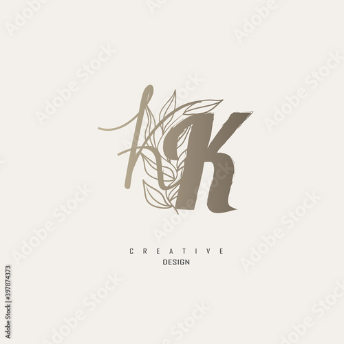 logo kk dengan warna emas, logo terinspirasi dari daun dan kuas.