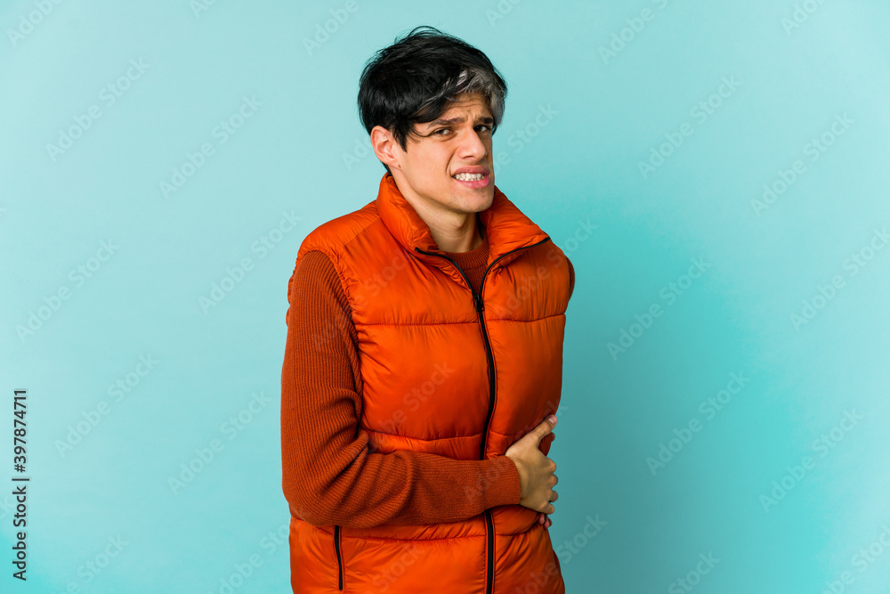 Fototapeta premium Young caucasian skinny man expressing emotions isolated on blue background