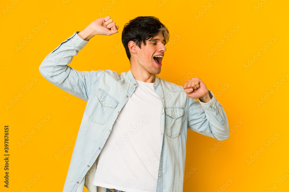 Young skinny hispanic man celebrating a special day, jumps and raise arms with energy. Young skinny hispanic man celebrating a special day, jumps and raise arms with energy.