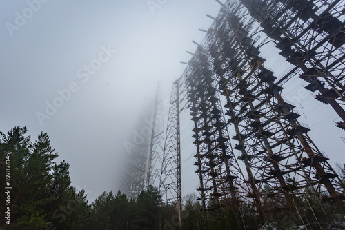 Soviet radar Duga in foggy weather. Russian woodpecker - over-the-horizon radar station near Chernobyl photo