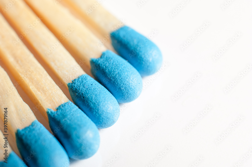 Blue matches on a white background Blue matches on a white background
