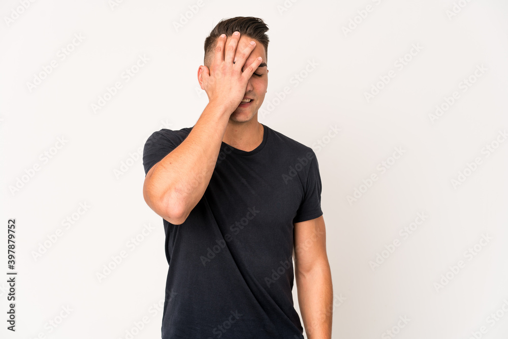 Young caucasian handsome man isolated laughing happy, carefree, natural emotion. Young caucasian handsome man isolated laughing happy, carefree, natural emotion.